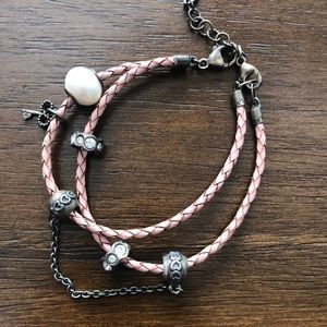 Pink braided double leather charm bracelet.
